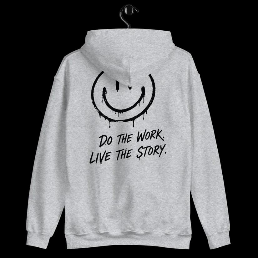 Back view of the Do the Work. Live the Story. hoodie showing the large distressed smiley design